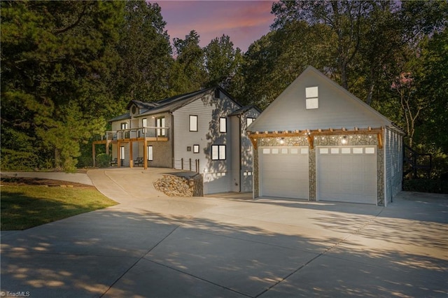 view of front of property with a balcony and a garage