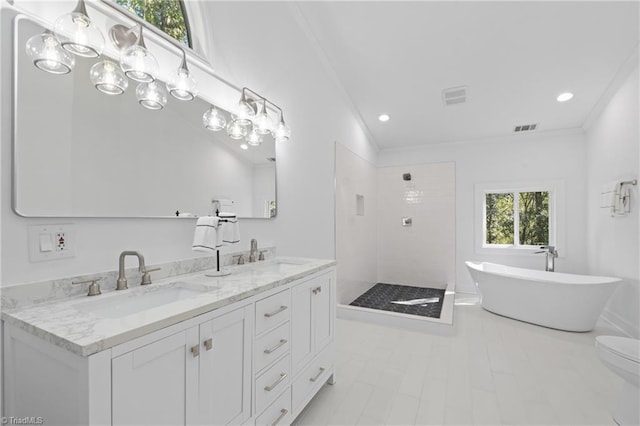 bathroom with crown molding, vanity, and independent shower and bath