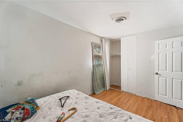 1020 Duchess Ct, Winston-Salem, NC 27107 - bedroom with light wood-style flooring and a closet