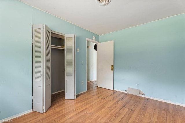 1020 Duchess Ct, Winston-Salem, NC 27107 - unfurnished bedroom featuring wood finished floors and a closet