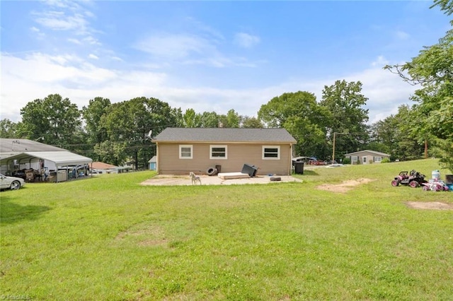 1020 Duchess Ct, Winston-Salem, NC 27107 - back of house with a lawn, a detached carport, and a patio area