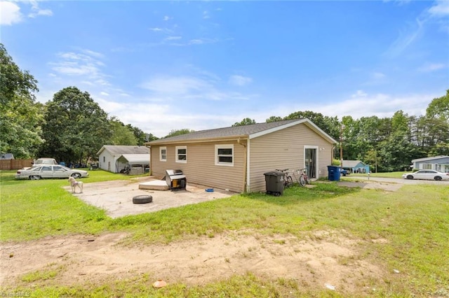 1020 Duchess Ct, Winston-Salem, NC 27107 - back of property with a lawn and a patio