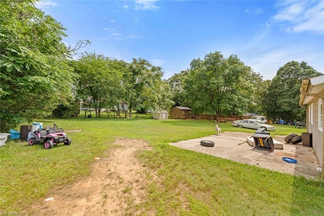 1020 Duchess Ct, Winston-Salem, NC 27107 - view of yard featuring a storage shed, a patio area, and view of scattered trees