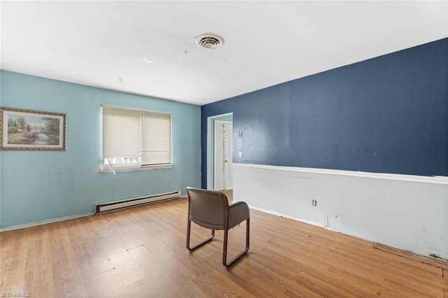 1020 Duchess Ct, Winston-Salem, NC 27107 - unfurnished room with a baseboard radiator and wood finished floors