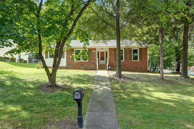 ranch-style home featuring a front lawn