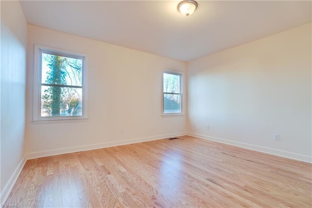 empty room with light wood-type flooring