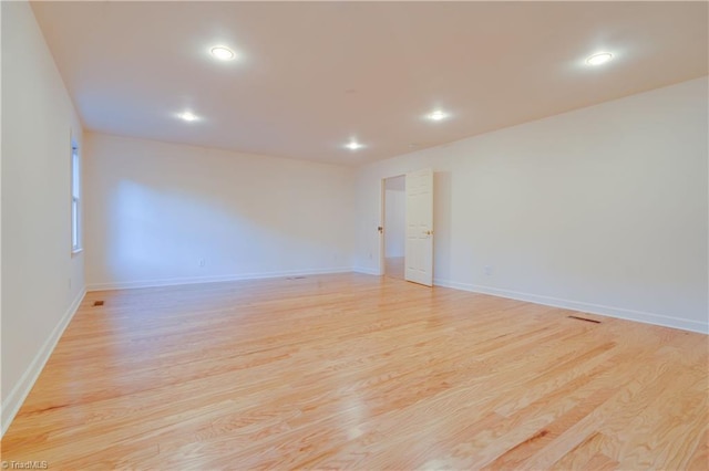 unfurnished room featuring light wood-type flooring