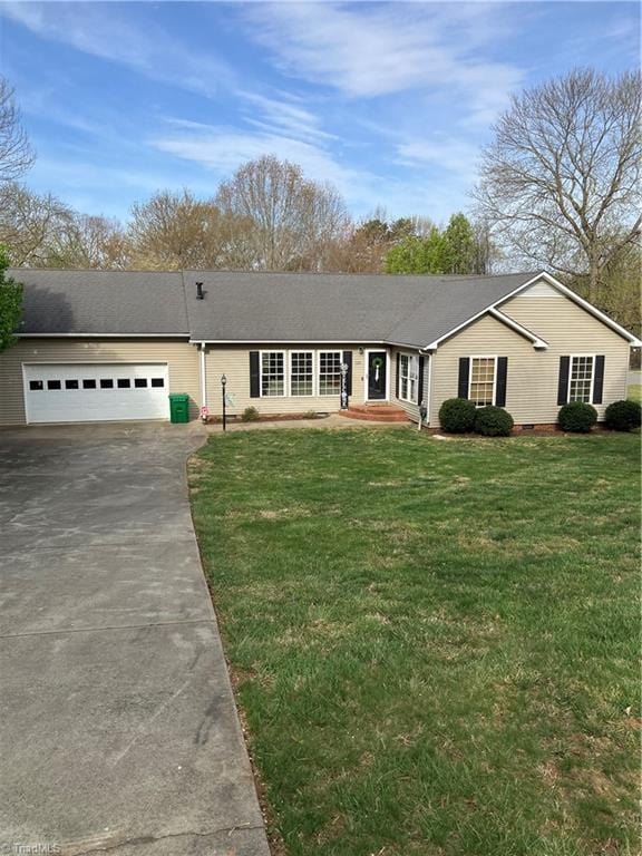 120 King Arthur Dr, King, NC 27021 - ranch-style home with a front lawn, roof with shingles, an attached garage, and concrete driveway