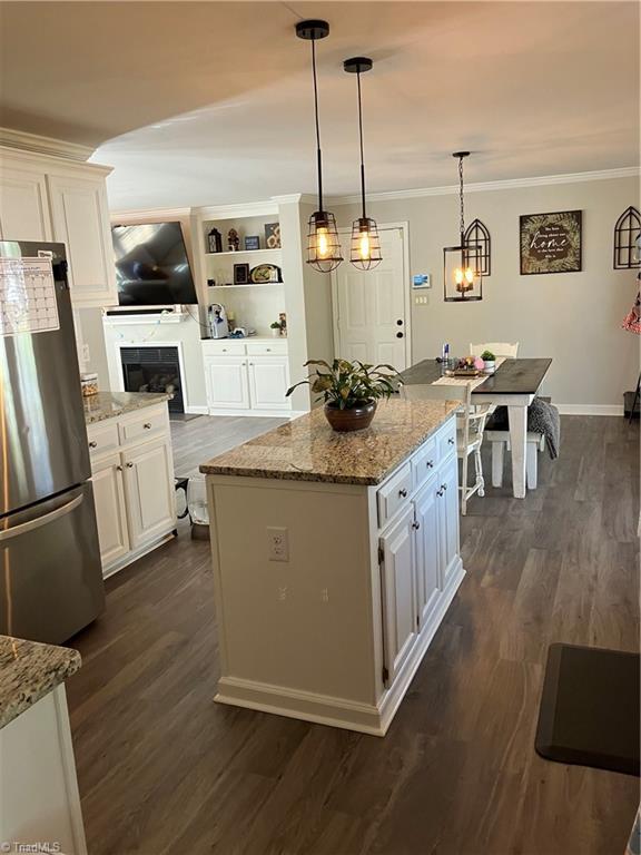120 King Arthur Dr, King, NC 27021 - kitchen featuring white cabinetry, ornamental molding, and freestanding refrigerator