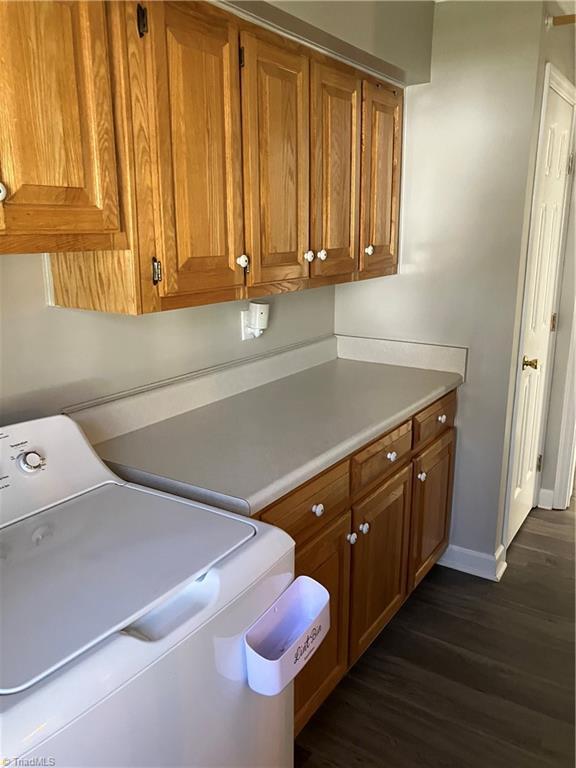 120 King Arthur Dr, King, NC 27021 - clothes washing area with cabinet space, washer / dryer, baseboards, and dark wood finished floors