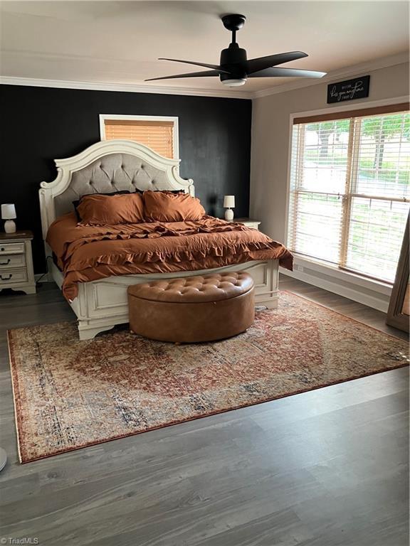 120 King Arthur Dr, King, NC 27021 - bedroom with ornamental molding, ceiling fan, and wood finished floors
