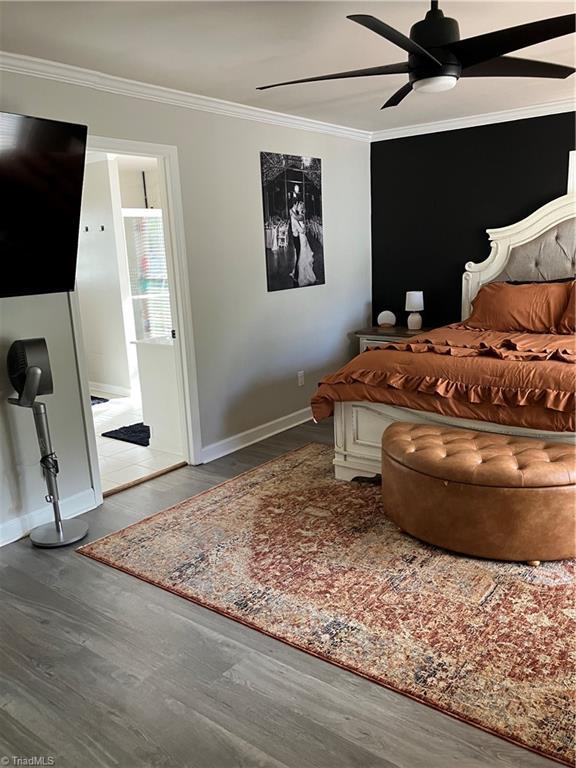 120 King Arthur Dr, King, NC 27021 - bedroom with a ceiling fan, crown molding, baseboards, and wood finished floors