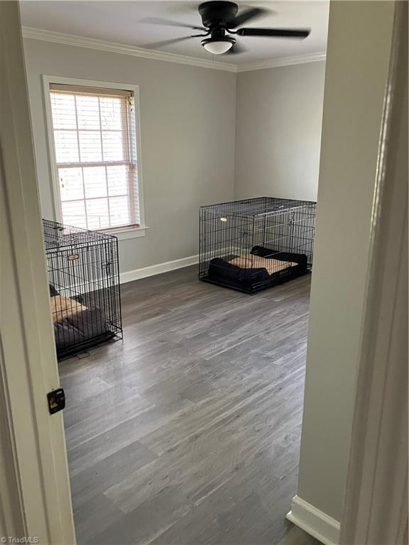 120 King Arthur Dr, King, NC 27021 - interior space with crown molding, baseboards, and wood finished floors