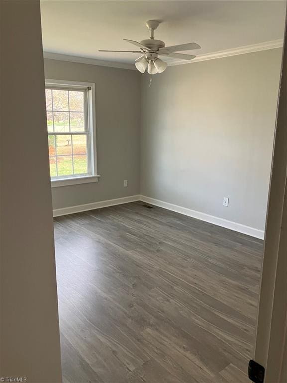 120 King Arthur Dr, King, NC 27021 - spare room featuring baseboards, dark wood-style floors, and crown molding