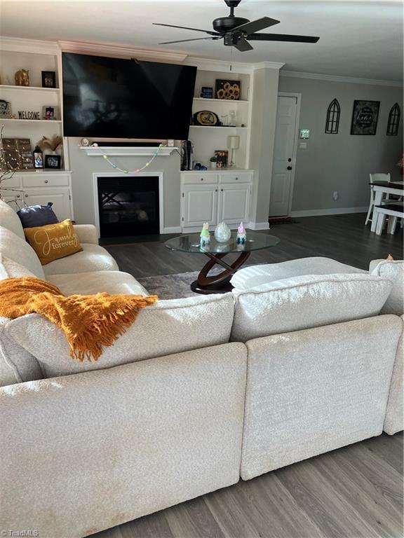 120 King Arthur Dr, King, NC 27021 - living area featuring a ceiling fan, crown molding, a fireplace, and wood finished floors