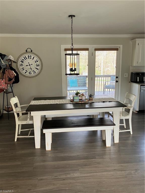 120 King Arthur Dr, King, NC 27021 - unfurnished dining area with dark wood-style flooring and ornamental molding