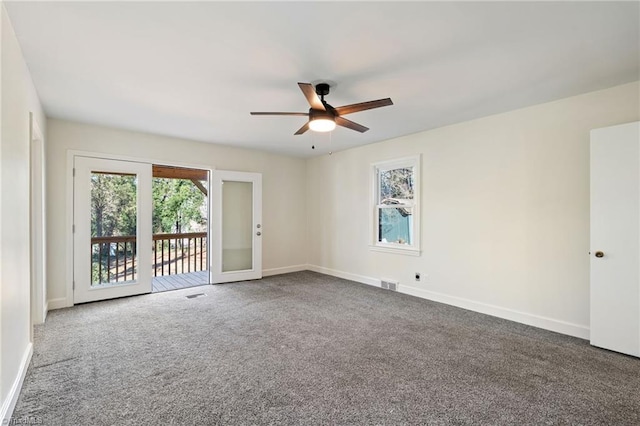 empty room with baseboards and carpet floors