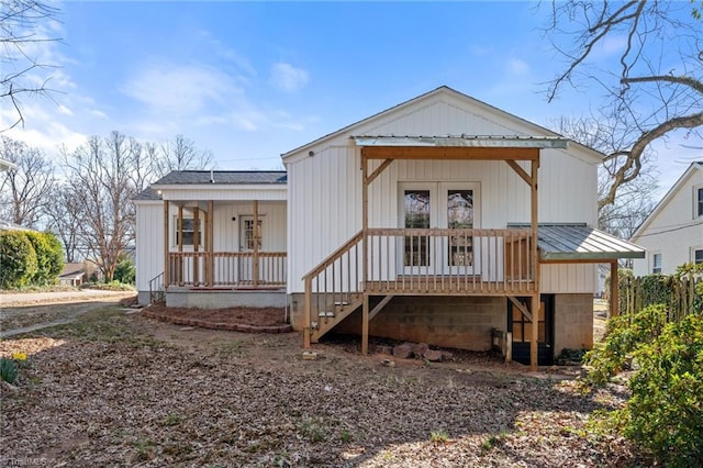 back of property featuring metal roof and covered porch