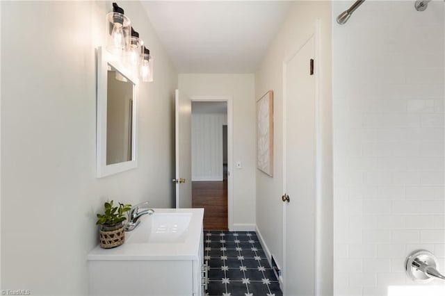 full bath with tile patterned floors, baseboards, shower / bathtub combination, and vanity