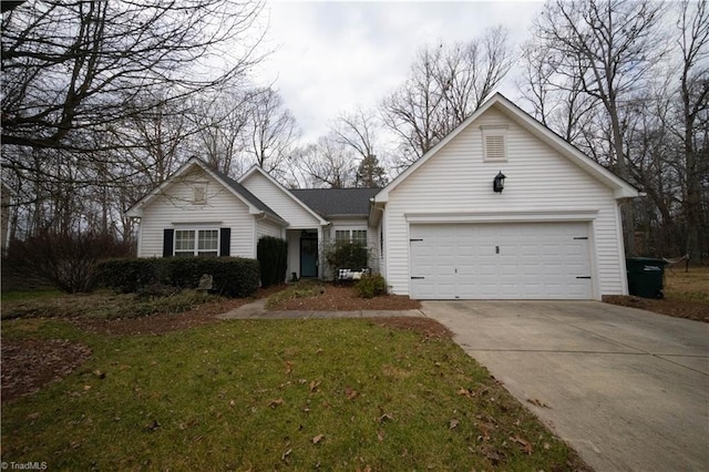 view of front of property with a garage and a front yard