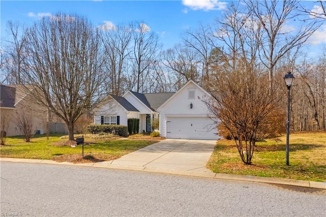 view of front of property featuring a garage and a front yard