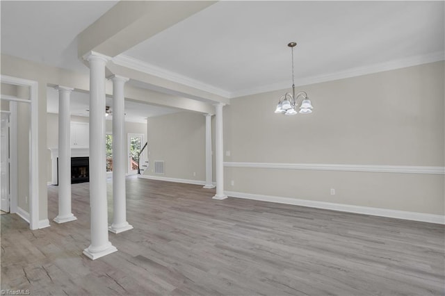 2101 Abbott Dr, Greensboro, NC 27455 - unfurnished living room featuring wood finished floors, crown molding, and a fireplace