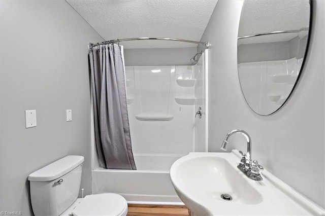 full bathroom with wood-type flooring, toilet, a textured ceiling, sink, and shower / bathtub combination with curtain