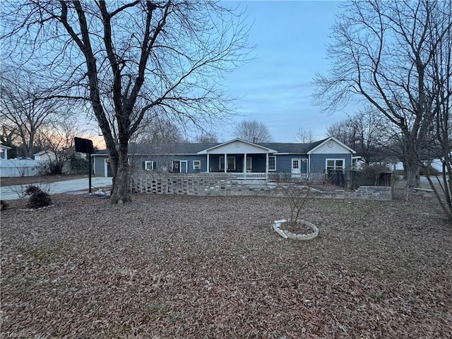 rear view of property with a porch