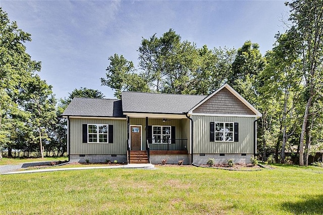 4503 Holly Leaf Rd, Ramseur, NC 27316 - view of front facade featuring crawl space, a porch, and a front lawn