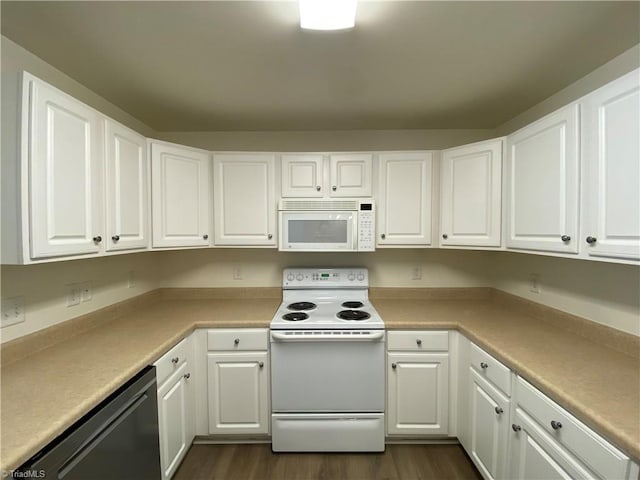 kitchen with dark wood-type flooring, white appliances, and white cabinets