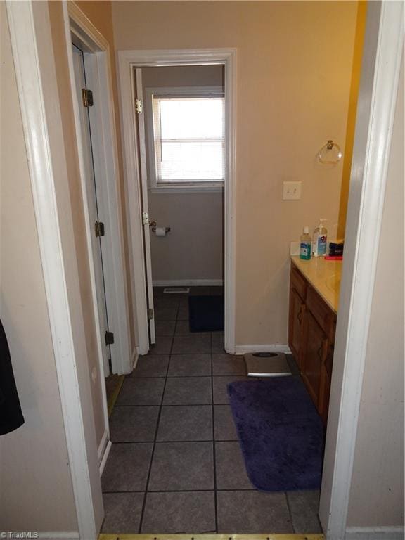 bathroom featuring vanity and tile patterned flooring