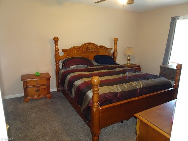 bedroom featuring ceiling fan and dark colored carpet