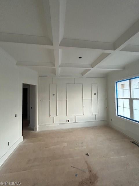 spare room with beam ceiling, visible vents, and coffered ceiling