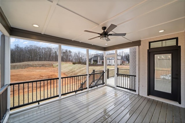 wooden terrace with a ceiling fan