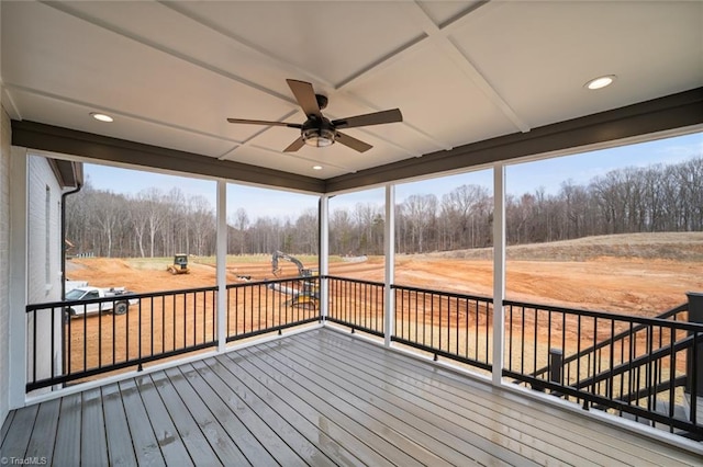 unfurnished sunroom with plenty of natural light and ceiling fan