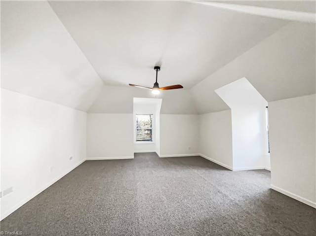 bonus room with ceiling fan, baseboards, vaulted ceiling, and carpet flooring