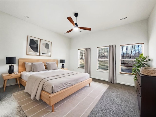 bedroom featuring a ceiling fan, baseboards, and carpet flooring