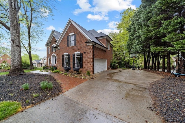 view of front facade with concrete driveway, brick siding, and a garage