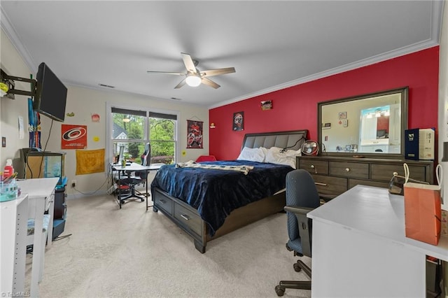 carpeted bedroom featuring baseboards, ornamental molding, and ceiling fan