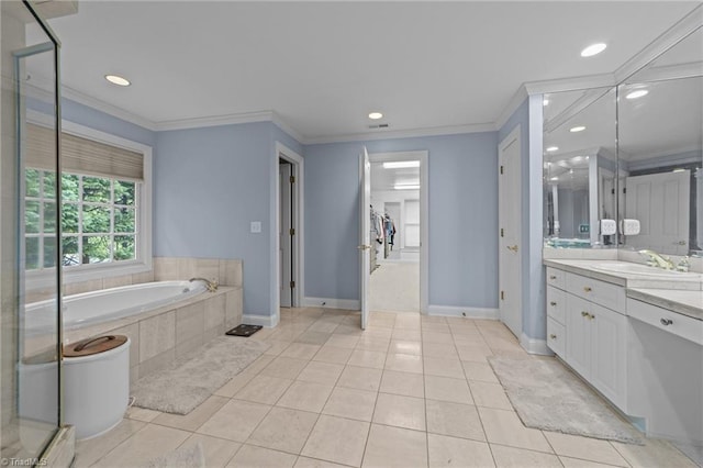 bathroom featuring tile patterned floors, a garden tub, and ornamental molding