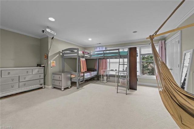 carpeted bedroom with crown molding, baseboards, and recessed lighting