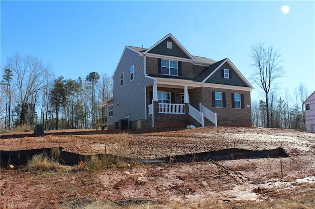 view of front of home with central AC and covered porch