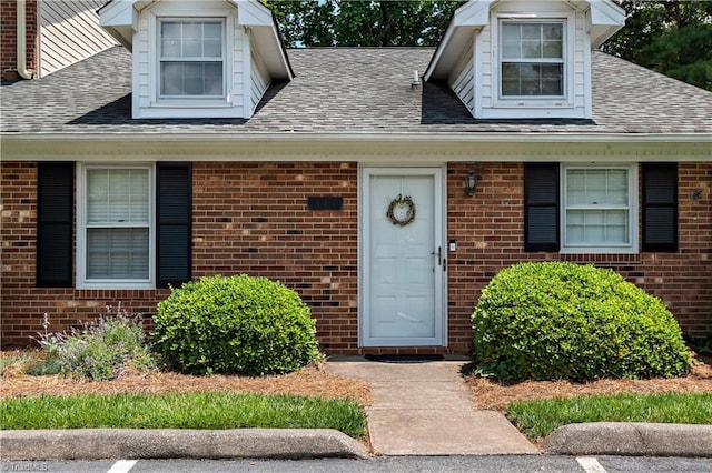 143 Chrisfield Cir, Winston-Salem, NC 27104 - property entrance with a shingled roof and brick siding