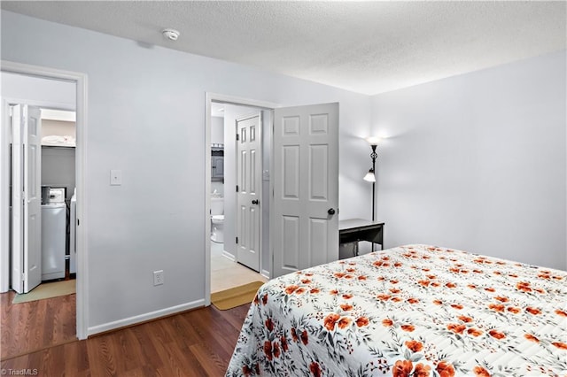 143 Chrisfield Cir, Winston-Salem, NC 27104 - bedroom with washer / dryer, wood finished floors, a textured ceiling, and baseboards