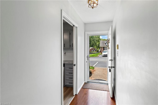 143 Chrisfield Cir, Winston-Salem, NC 27104 - doorway with dark wood-style floors and baseboards