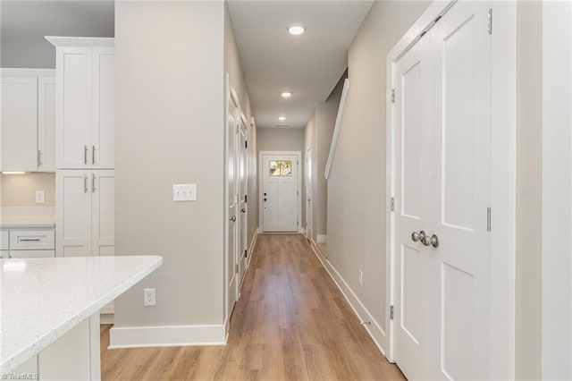 corridor featuring light wood-type flooring