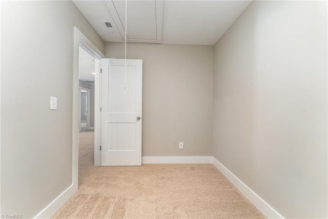 unfurnished room with light carpet