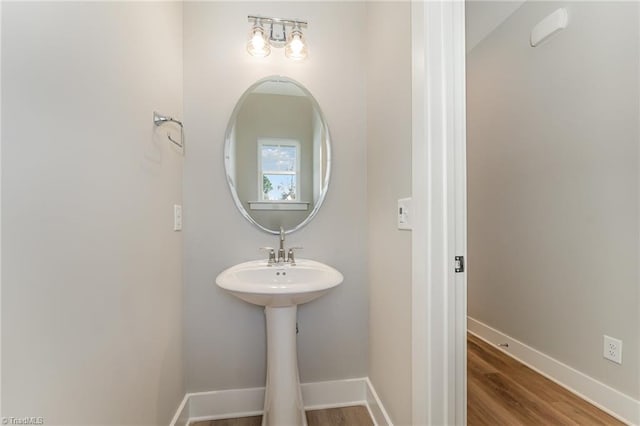 bathroom with hardwood / wood-style floors