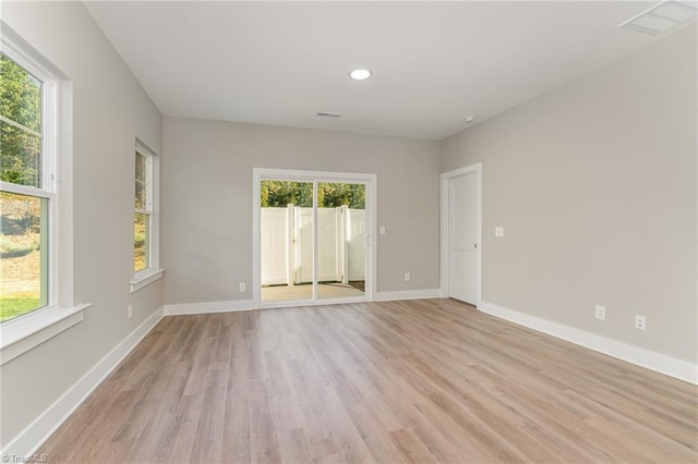 spare room featuring light wood-type flooring