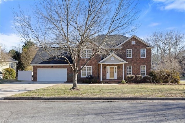 view of front of house featuring a garage and a front lawn